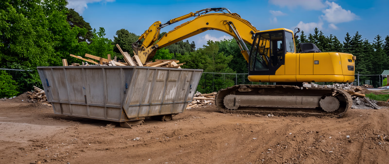 Heavy equipment performing safe structural demolition and site clearing